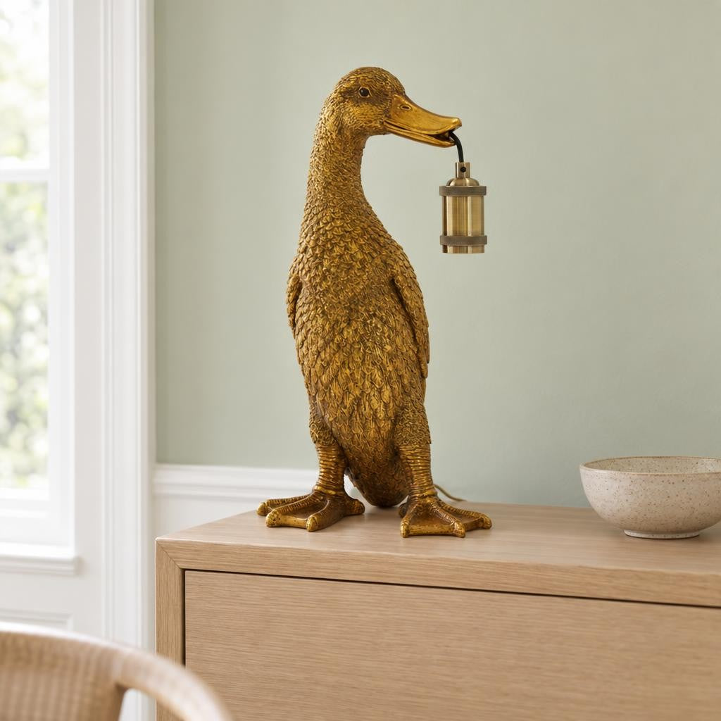 Pronssinen Duck-pöytävalaisin – Light & Living – tunnelmakuva