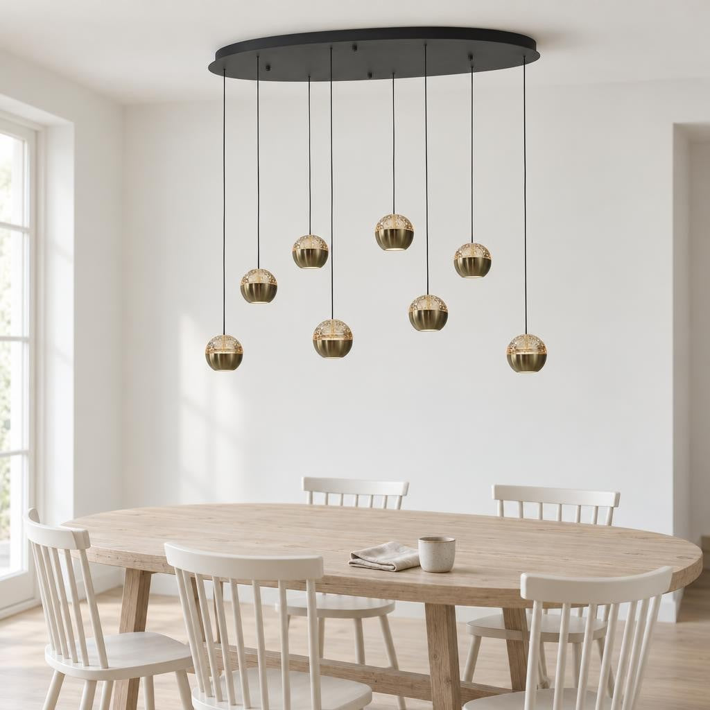 Belluno Oval Pendant Light in Black and Brass, 8-Light – lifestyle image