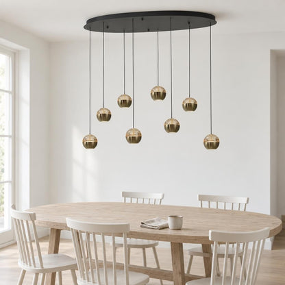 Belluno Oval Pendant Light in Black and Brass, 8-Light – lifestyle image