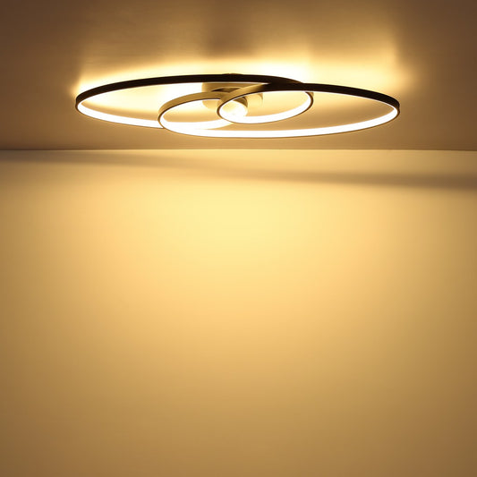 Zwarte metalen plafondlamp met ovale lichtlussen en spiraalvorm – sfeerbeeld