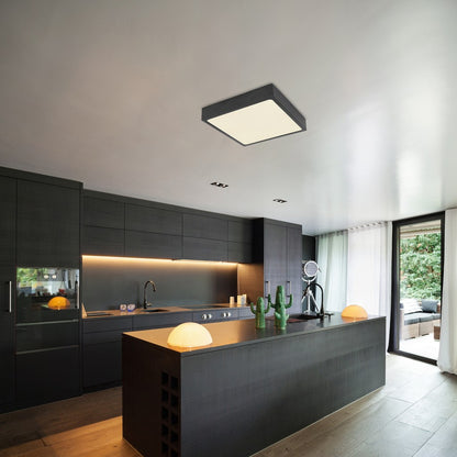 Zwarte metalen plafondlamp met opale diffuser en afgeronde hoeken – sfeerbeeld